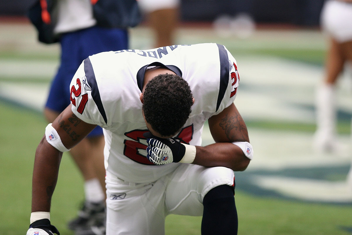 NFL player kneeling